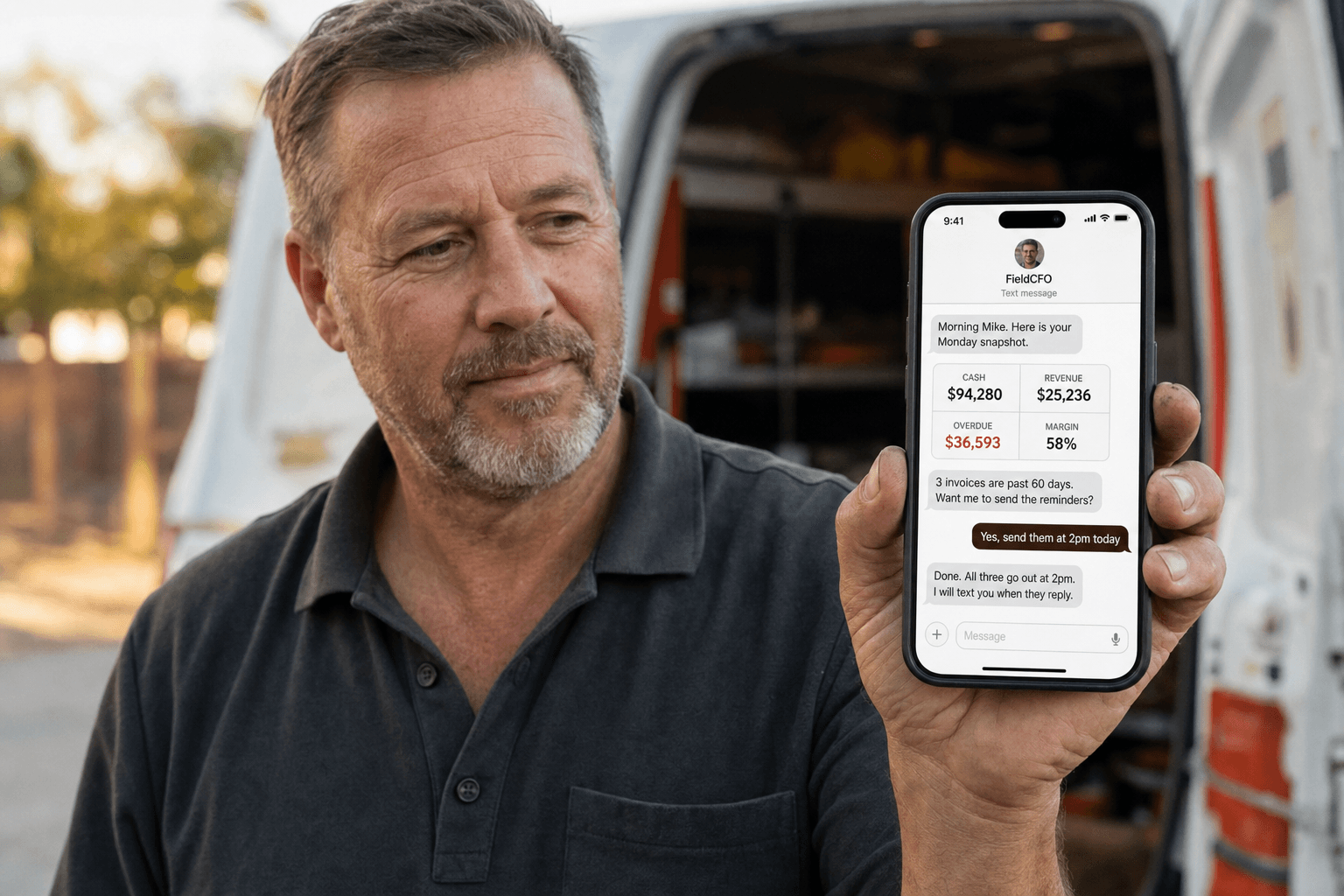 A field service business owner reading his FieldCFO numbers on his phone outside his work van